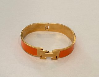 Brazalete Hermès Naranja y Dorado