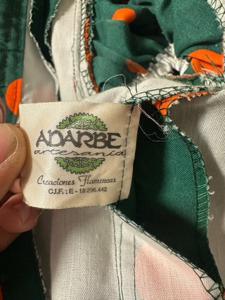 Traje de flamenca verde y naranja