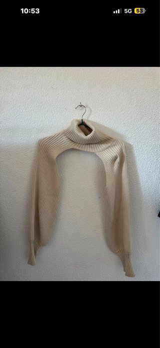 Jersey cuello alto beige sin mangas