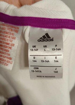Chaqueta deportiva Adidas blanca y morada