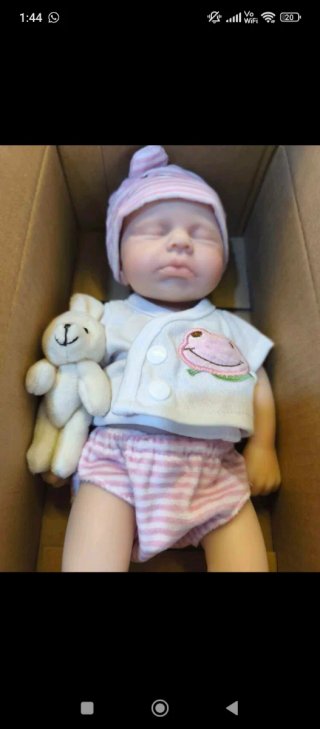 Muñeca de silicona bebé con peluche