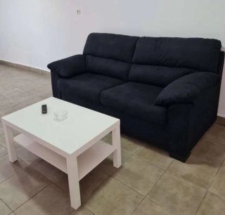 Sofá azul y gris de tela