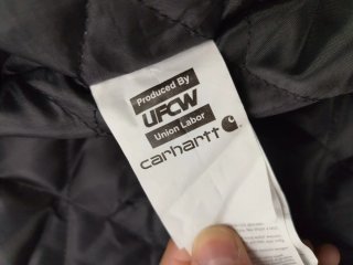 Chaqueta Carhartt con capucha gris y negra