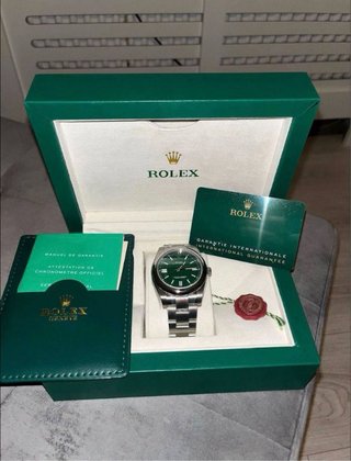 Reloj Rolex con caja y documentación