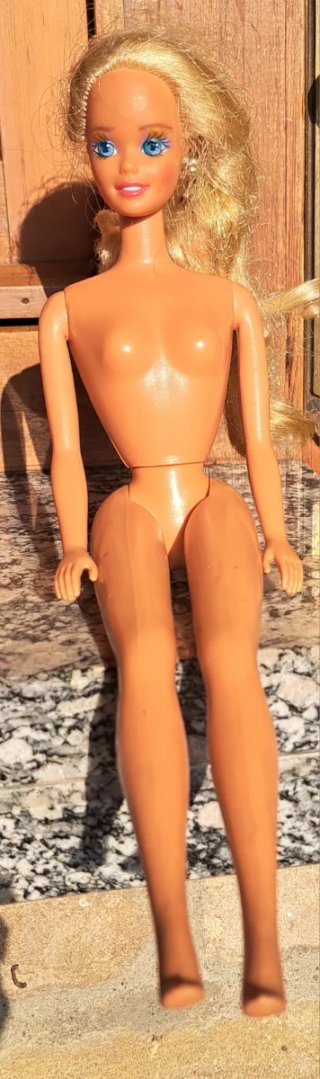 Barbie mattel con vestito arancione e top argento