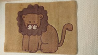 Alfombra infantil con diseño de león