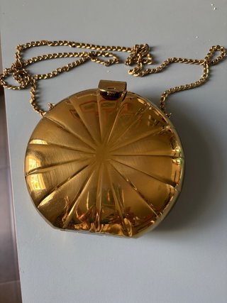 Bolso fiesta dorado redondo