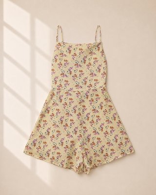 Mono corto floral amarillo espalda abierta