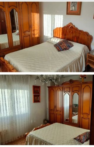 Muebles de dormitorio: armario y cama de madera.