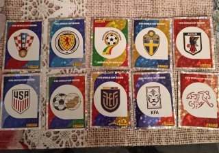 Lote 10 Cromos Escudos Panini Mundial 2026
