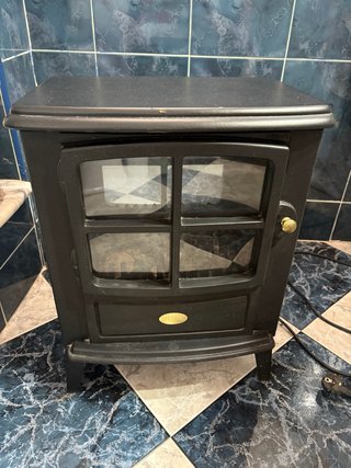 Estufa negra imitación chimenea