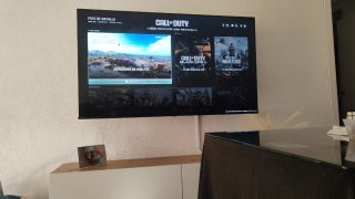 PS4 (PlayStation 4) con mando y juegos dentro