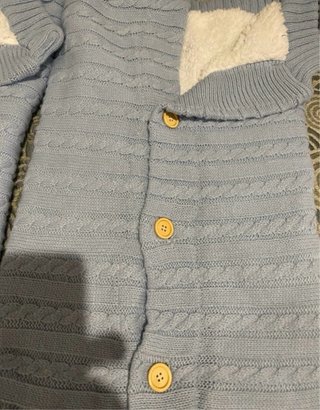 Saco de bebé azul tejido