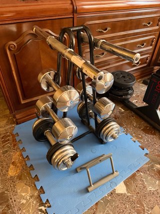 Banco de gimnasio completo con pesas