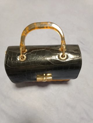 Bolso de mano con efecto cocodrilo