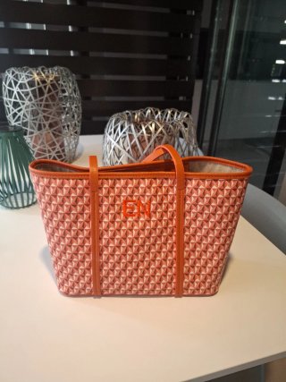 Bolso de mano naranja con monograma EN