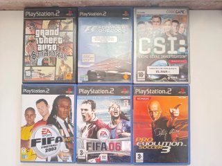 Consola PlayStation 2 con 2 mandos y juego