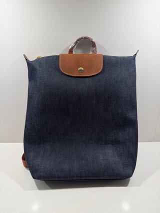 Mochila vaquera azul marino con detalles marrones