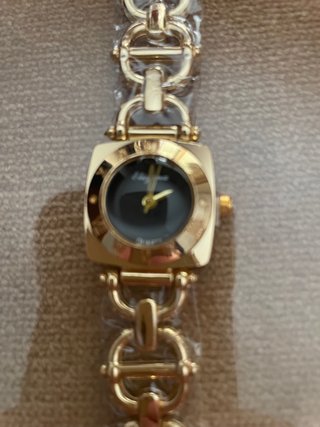 Reloj Estribos Dorado