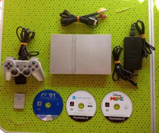 PlayStation 2 Gris/Plata Completa + Juegos Regalo