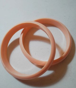 Par de pulseras color salmón