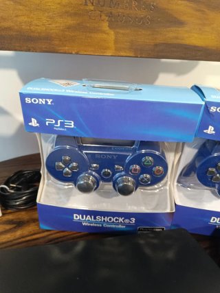 Consola PS3 con 2 mandos y 4 juegos