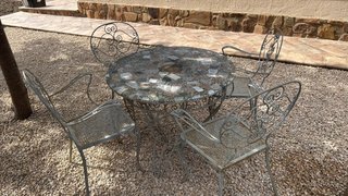 Mesa de jardín piedra y 4 sillas metal