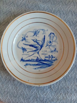 Plato de cerámica vintage con pájaro