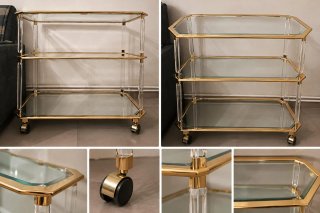 Mesa camarera de cristal y metal dorado