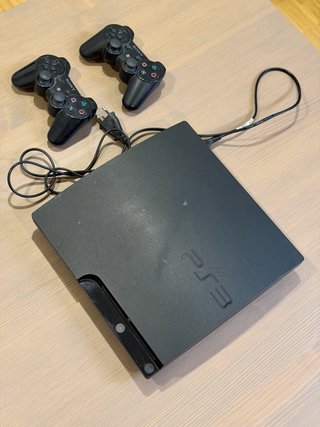 Consola Sony PS3 Slim + 2 mandos