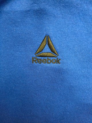 REEBOK Royal Blue c/capucha y bolsillo canguro.