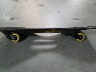 Monopatín Waveboard Oxelo Negro y Dorado