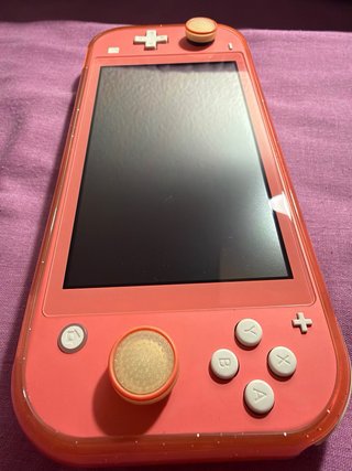 Nintendo Switch Lite Coral + Juegos