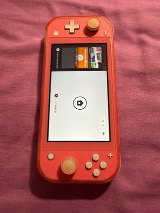 Nintendo Switch Lite Coral + Juegos