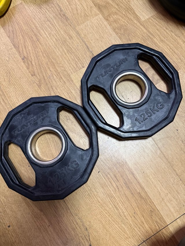 2 discos Tunturi 1.25kg olímpicos