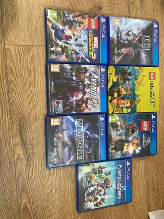 PS4 (PlayStation 4) con 2 mandos y 7 juegos