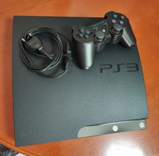 Consola PS3 con mando y 2 juegos