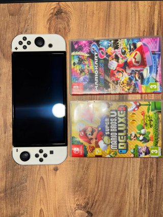 Pack Nintendo Switch OLED 64GB + 2 Juegos + Extras