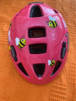 Casco infantil UVEX rosa con abejas