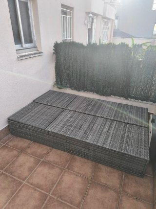 Tumbona doble de jardín de ratán con cojín