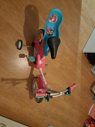 Bicicleta infantil rosa con ruedines decatlon