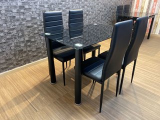 Mesa cristal 4 sillas negras - Oferta.
