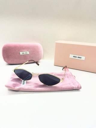 Gafas de sol Miu Miu Cat Eye Doradas Negras