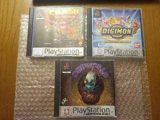 Lote Cajas y Manuales PS1 Crash, Digimon, Oddworld