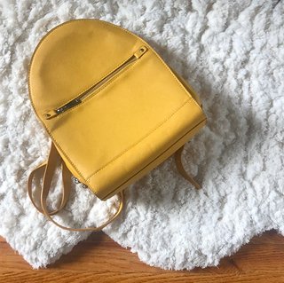 Mochila Zara amarilla texturizada con cremallera