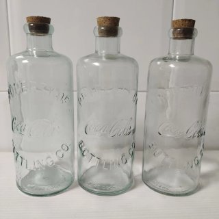 3 bottiglie Coca-Cola con tappo di sughero