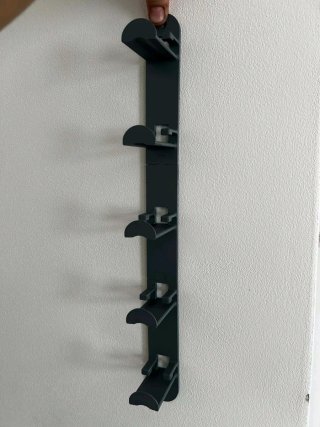 Soporte de pared para gorras