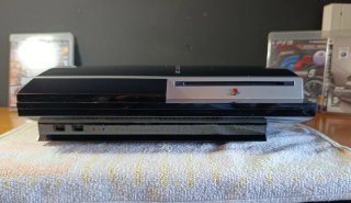 Consola PS3 con 300 Gb + Volante Ferrari + Giochi