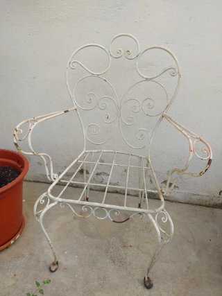 Silla antigua hierro forjado jardín