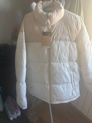 The North Face plumífero beige y blanco